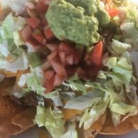 Mac Nachos · Corn nacho chips topped with real cheddar cheese, lettuce, homemade salsa and guacamole. Add...