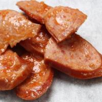 Sausage (1/2 Lb) · 1/2 lb. Seasoned ground meat that has been wrapped in a casing.
