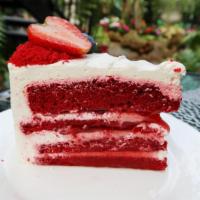 Red Velvet Cake · A double layer of red velvet cake surrounded and topped with cream cheese icing, garnished w...