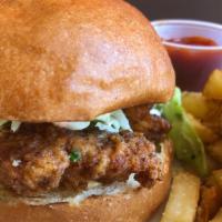 The Fried Chicken Sandwich · Buttermilk chicken with a perfect crust served on a brioche bun with chipotle remoulade, ran...