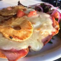 Sorolla Sandwich · Ham, grilled pineapple, mozzarella cheese, roasted pepper mayo, and tomatoes on a baguette. ...