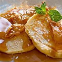 L'Hermitage · Two buttermilk pancakes with caramelized apples. Served with syrup.
