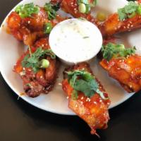 Bbq Fried Chicken Wings · Smother in a perfect lacquer of BBQ sauce.