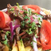 Peruvian Stoner Frjtz · Sirloin steak with stewed tomatoes, red onions, and a little Asian soy tanginess.