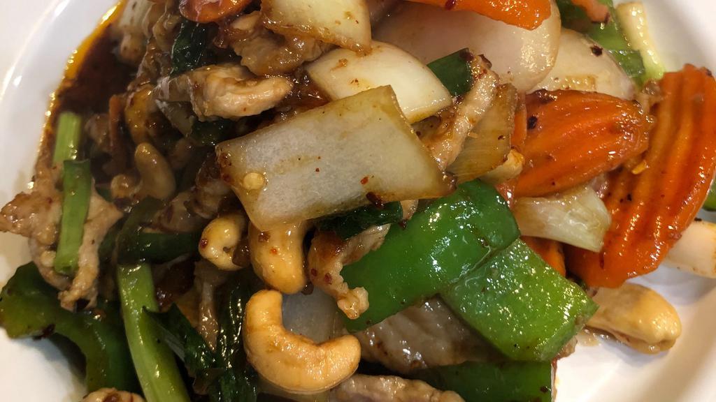Cashew Nuts · Gluten free.  Stir fried meat with roasted chili paste, carrots, onions ,bell peppers, green onion and cashew nuts.