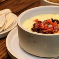 Green Chile Queso · Flour tortillas. Creamy green chili cheese dip finished.