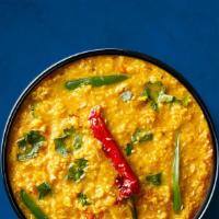 Divine Yellow Lentils (Vegan) · Yellow lentils, slow-cooked to perfection and tempered with cumin, garlic, and chilies. Serv...