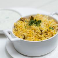 Chicken Dum Biryani  · Basmati rice, saffron, garam masala, and raita.