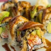 Dragon Roll · Fresh water eel & avocado over California roll with sweet sauce.