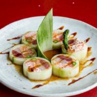 Kristy Roll · Tuna, salmon, yellowtail, crabmeat, asparagus, wrapped with cucumber. Apple sauce & sweet sa...