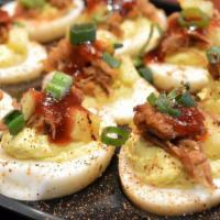 Deviled Egg Platters · Choose from: TRADITIONAL DEVILED EGGS with Diced Tomatoes & Chives; LUAU DEVILED EGGS topped...