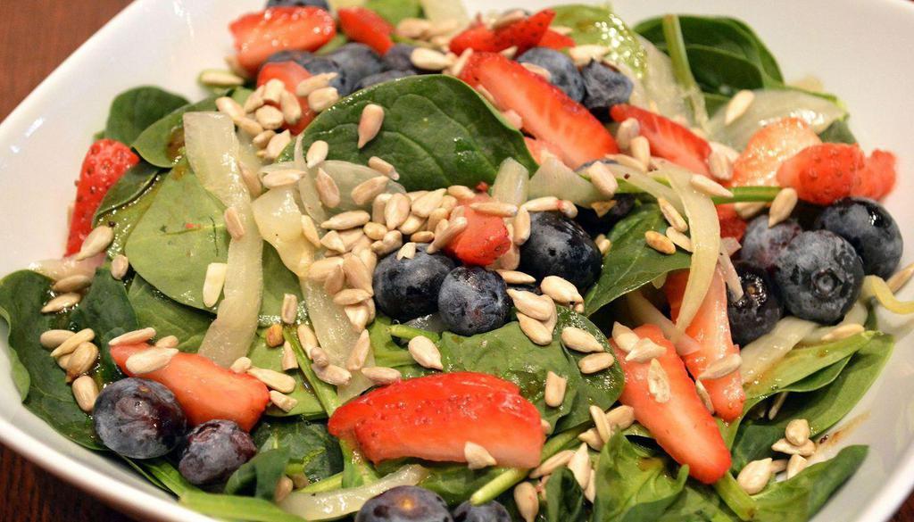 Vegan Berry Spinach Salad · Baby Spinach, Strawberries, Blueberries, Roasted Onions & Sunflower Seeds with Balsamic Poppyseed Vinaigrette