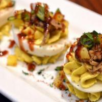 Luau Deviled Eggs · Topped with BBQ Pulled Pork, Diced Grilled Pineapple & Green Onion, garnished with House-Mad...