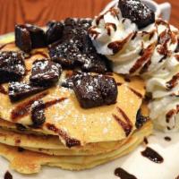 Brownie Pancakes Tall Stack (4) · Four Buttermilk Pancakes with Chocolate Brownie Pieces, drizzled with Chocolate Sauce, garni...