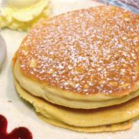 Short Stack Buttermilk Pancakes (2) · Two Pancakes garnished with Powdered Sugar and served with Butter and Maple Syrup