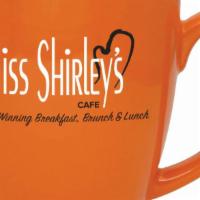 Coffee Mug · 16 oz. Duo-Toned Orange Ceramic Coffee Mug with Miss Shirley's Cafe logo; Hand wash recommen...