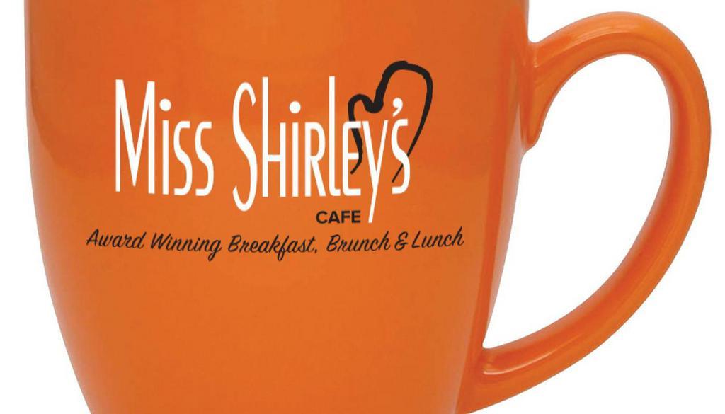 Coffee Mug · 16 oz. Duo-Toned Orange Ceramic Coffee Mug with Miss Shirley's Cafe logo; Hand wash recommended.