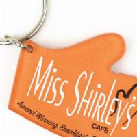 Oven Mitt Key Chain · Two-Sided Orange Acrylic Oven Mitt-Shaped Key Chain with Miss Shirley's Cafe logo
