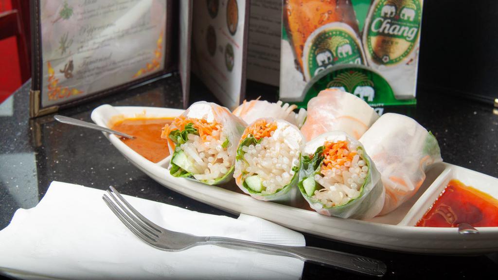 Fresh Spring Rolls (3) · Rice paper wrapper with green lettuce, cucumber, carrots, cabbage, beansprouts, special peanut sauce, and sweet plum sauce.