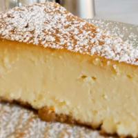 Ricotta Cheesecake · Our Family recipe of fresh Ricotta, Mascarpone Cheese and a hint of Grand Marnier.