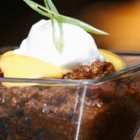Uncle D'S Famous Chili · Topped with cheddar sauce & Green Onions & a spoonful of thick sour cream served with homema...