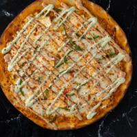 Paneer Tikka Pizza · Pizza loaded with tikka masala, mozzarella, chicken, onions, green peppers, moti sauce, cila...