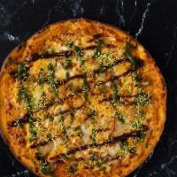 Samosa Smash · Pizza with mozzarella, crushed samosa, onions and sev, topped with tamarind and mint chutney.