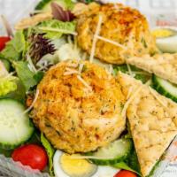Wild-Caught Crab Cake Salad · Two pcs grilled crab cake, organic crispy mix, organic romaine heart lettuce, roasted red on...