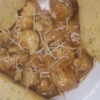 Smothered Mushrooms · Whole button mushrooms sautéed in butter, garlic, and chardonnay, then finished with a touch...
