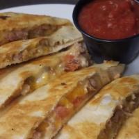 Quesadillas · A lightly grilled flour tortilla stuffed with a three cheese blend and pico de gallo. Served...