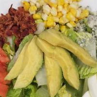 Cobb Salad · Chopped romaine and spinach served with diced tomatoes, crispy bacon, hardboiled egg, avocad...