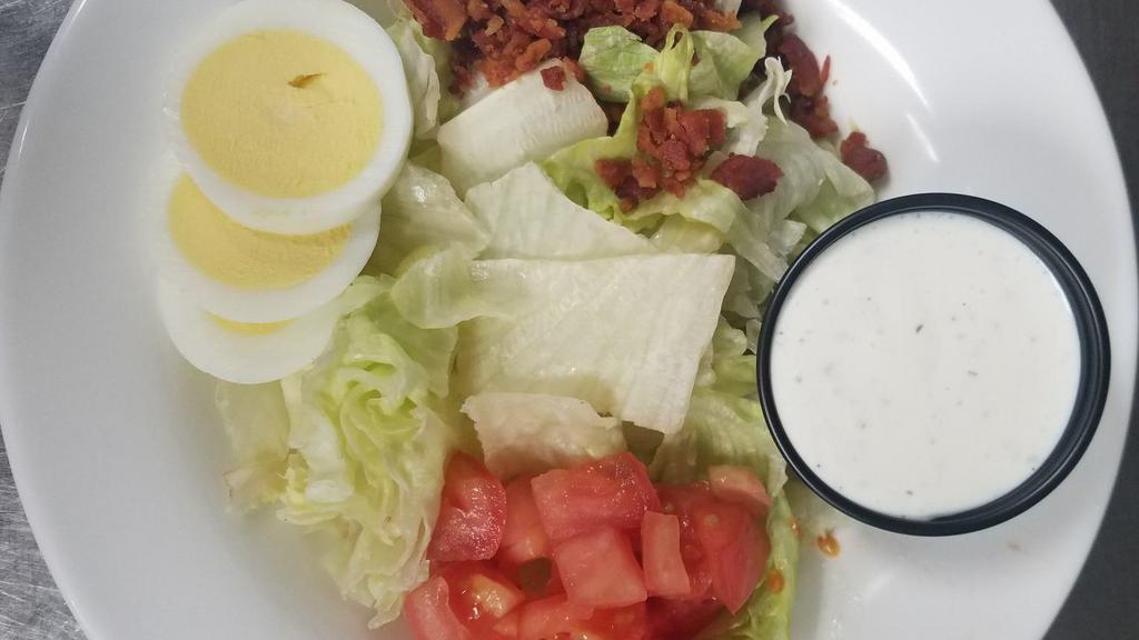 Ob Salad · Romaine lettuce simply garnished with hardboiled egg, diced tomatoes, and crumbled bacon. Served with your choice of dressing.
