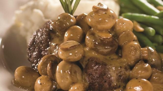 Smothered Sirloin · 8oz. top sirloin flame broiled to your specification then topped with our signature smothered mushrooms and their delectable sauce.