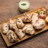 Chicken Malai · All white meat marinated in yogurt, herbs and spices cooked with coconut and creamy sauce.