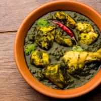 Chicken Palak · Juicy tender pieces of chicken cooked with special spices, served with creamy spinach curry.