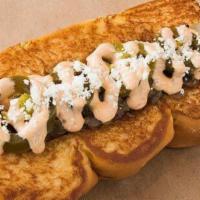 Old Town · Smoked bacon wrapped dog, caramelized onions, chipotle aioli, picked jalapeños, cotija cheese.