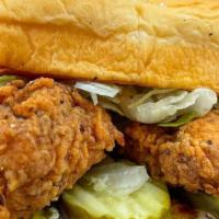 The Hot Chick · Nashville style fried or grilled chicken tenders, Haus slaw, pickles, secret sauce.