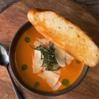 Tomato Basil Bisque Bowl · creamy tomato basil soup, topped with parmesan and basil oil. Gluten Free