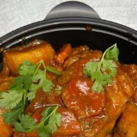 Stew Chicken · Chicken seasoned with Caribbean spices and stewed in a sweet brown gravy with carrots and po...