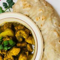 Boneless Curry Chicken( Roti ) · Boneless chicken breast seasoned & marinated with Caribbean herbs & spices and potatoes into...