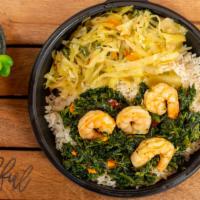 Spinach And Shrimp With Plain Rice · Spinach is sauteed with Caribbean herbs and spices and shrimp over a bed of plain rice.