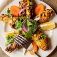 Tandoori Wings · Chicken wings seasoned with Indian spices and cooked in tandoori clay oven.