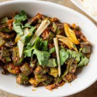 Okra Masala · Crispy okra cooked with ginger, onions, tomatoes, herbs and spices.
