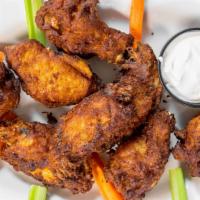 Buffalo Wings · Deed-fried chicken wings coated in a spice sauce and served with blue cheese dressing.
