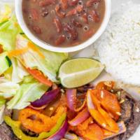 Bistec Encebollado · Sirloin steak cooked with onions (rice, beans, one tortilla and salad).