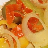 Escovitch Fish Snapper · pan-fried fish until crispy  then covered in lightly  pickled  vegetables,bell peppers,carro...