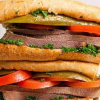 Zaban Sandwich · Seasoned beef tongue. Served on a hoagie with tomatoes, pickles, and parsley.