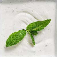 Mast-O-Khiar · Persian yogurt with cucumbers and mint. Served with complimentary lavash or baked taftoon.