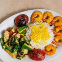 Shrimp Kabob · Marinated shrimp served with saffron rice and sauteed vegetables. Marinated in Yekta’s speci...
