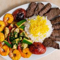 Surf And Turf · Marinated shrimp kebab and strips of filet mignon. Served with saffron basmati rice and saut...